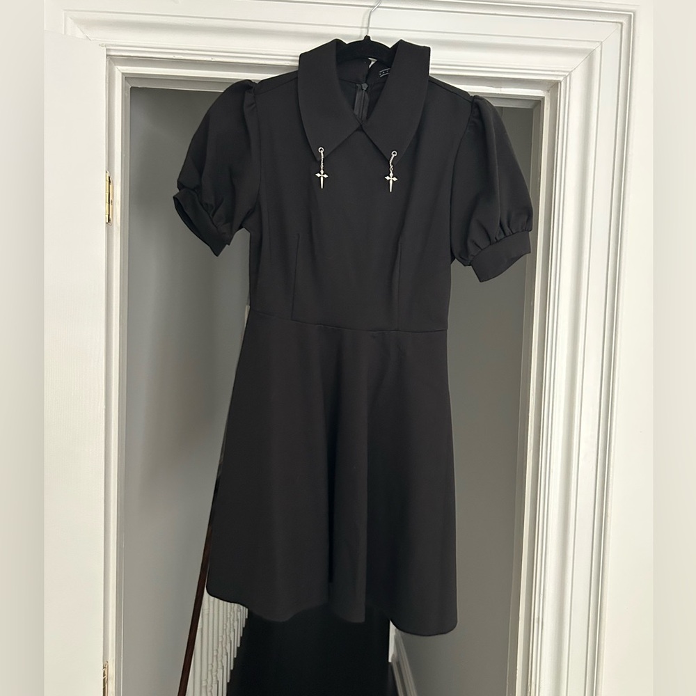 BLACK DRESS WITH PETER PAN COLLAR AND SILVER CROSS DETAILS